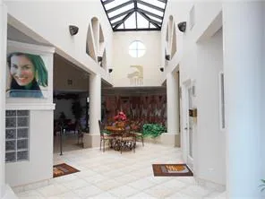 a view of living room with furniture and a chandelier