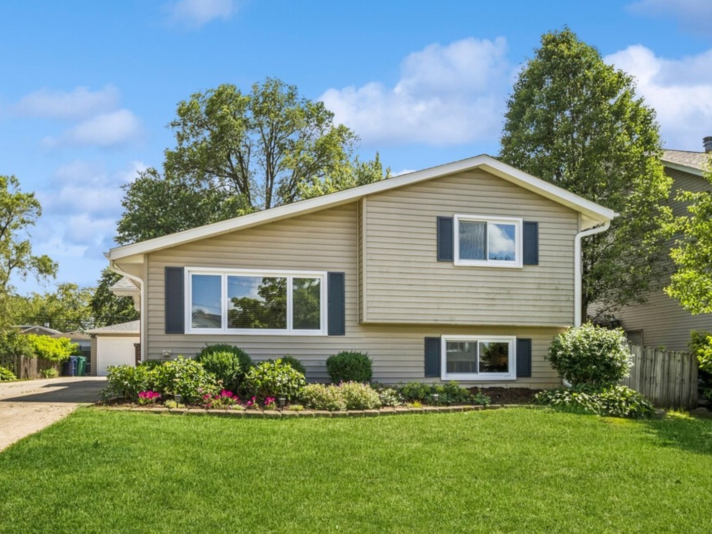221 West Harrison Road Lombard, IL 60148 - Photo 1 of 24 a front view of a house with a yard