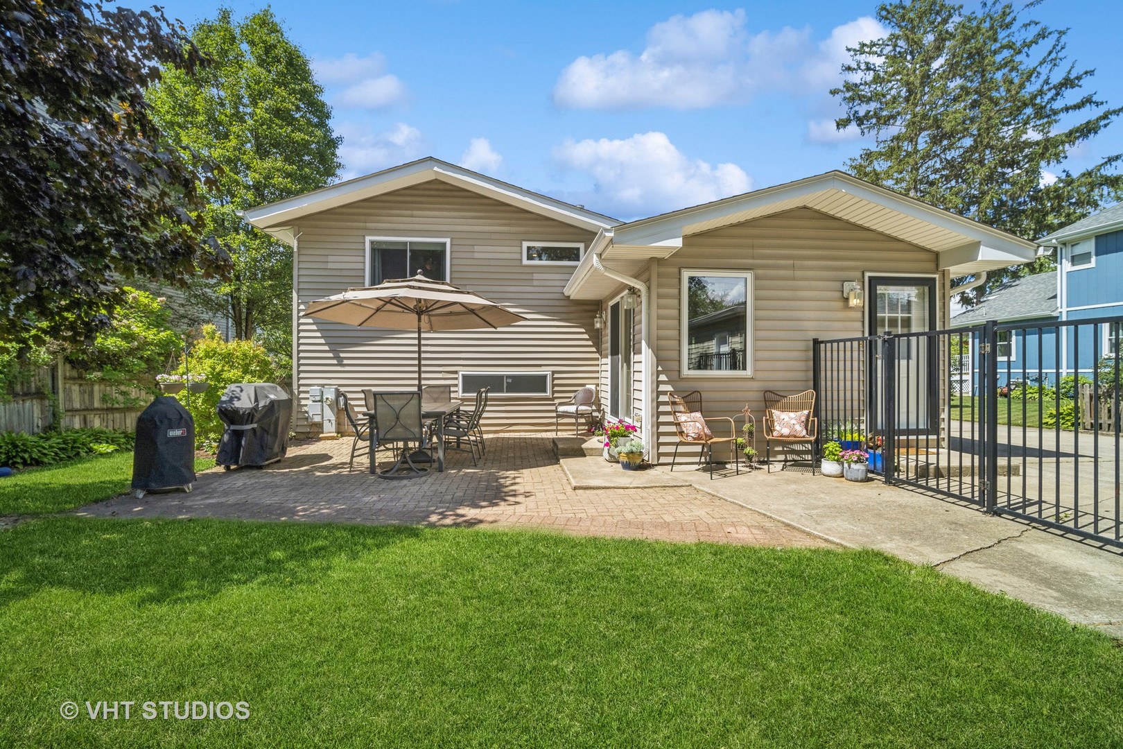 221 West Harrison Road Lombard, IL 60148 - Photo 19 of 24 a front view of house with yard and outdoor seating