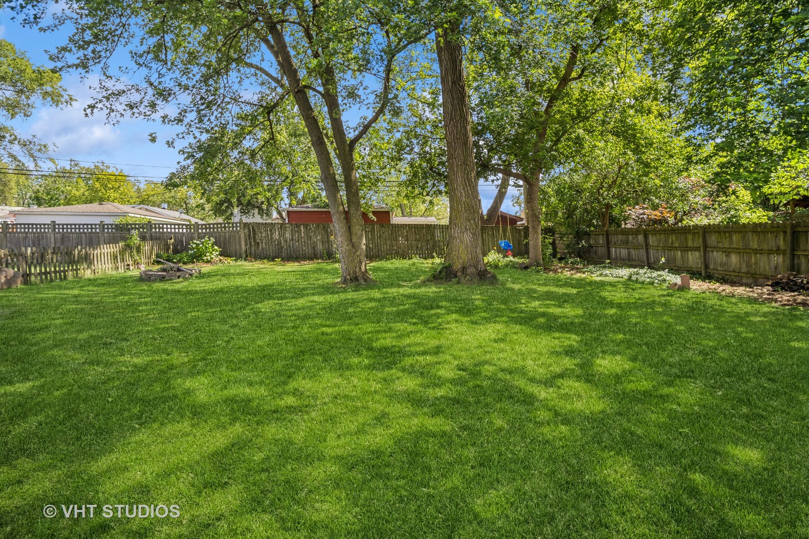 221 West Harrison Road Lombard, IL 60148 - Photo 20 of 24 a backyard of a house with lots of green space and fountain