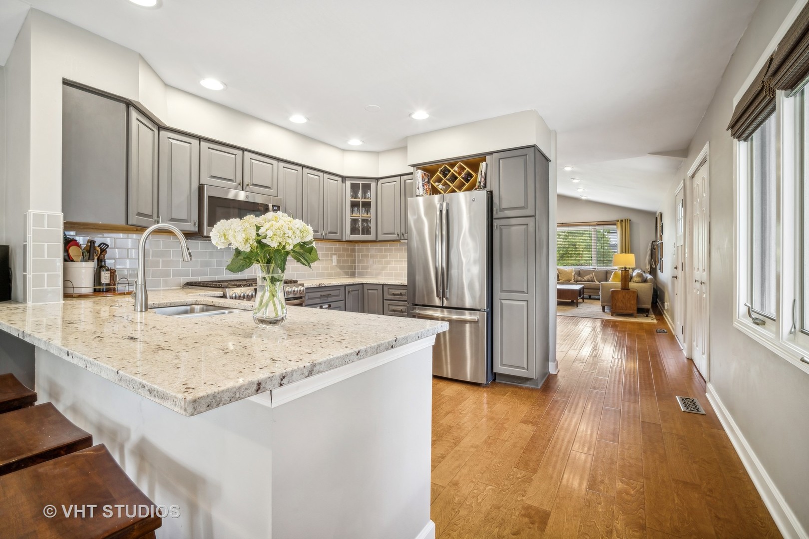 221 West Harrison Road Lombard, IL 60148 - Photo 5 of 24 a kitchen with stainless steel appliances granite countertop a refrigerator and a sink