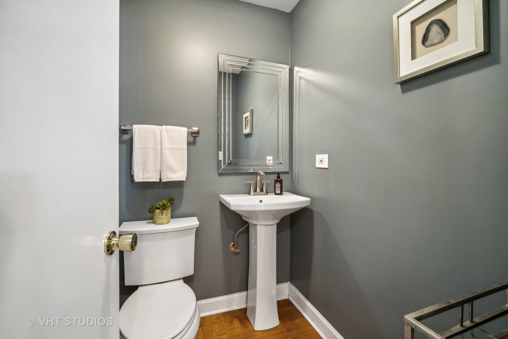 221 West Harrison Road Lombard, IL 60148 - Photo 10 of 24 a bathroom with a sink toilet and a mirror