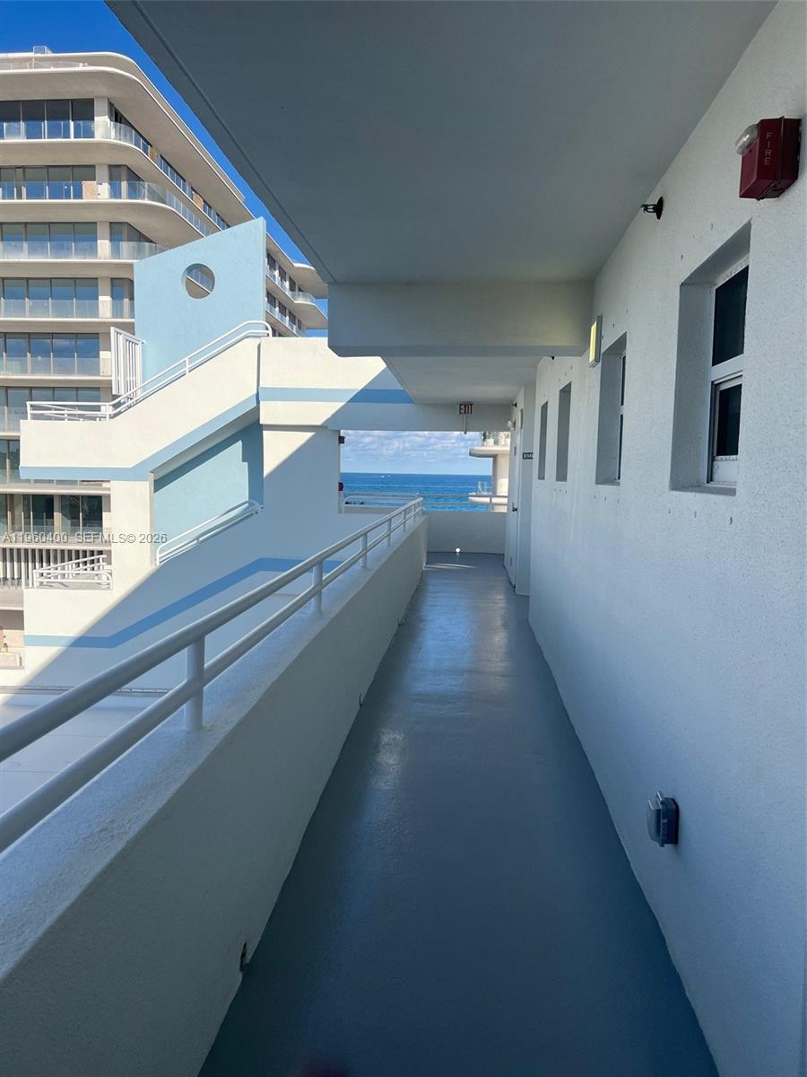 9156 Collins Avenue, Unit 502 Surfside, FL 33154 - Photo 11 of 20 a view of entryway and hall with wooden floor