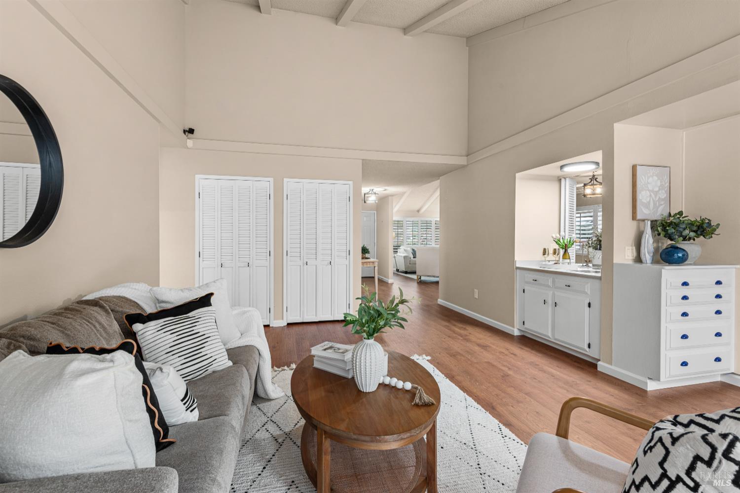 The hallway serves as a smooth transition point, drawing your eyes toward the heart of the home. Lots of storage in this lovely home.