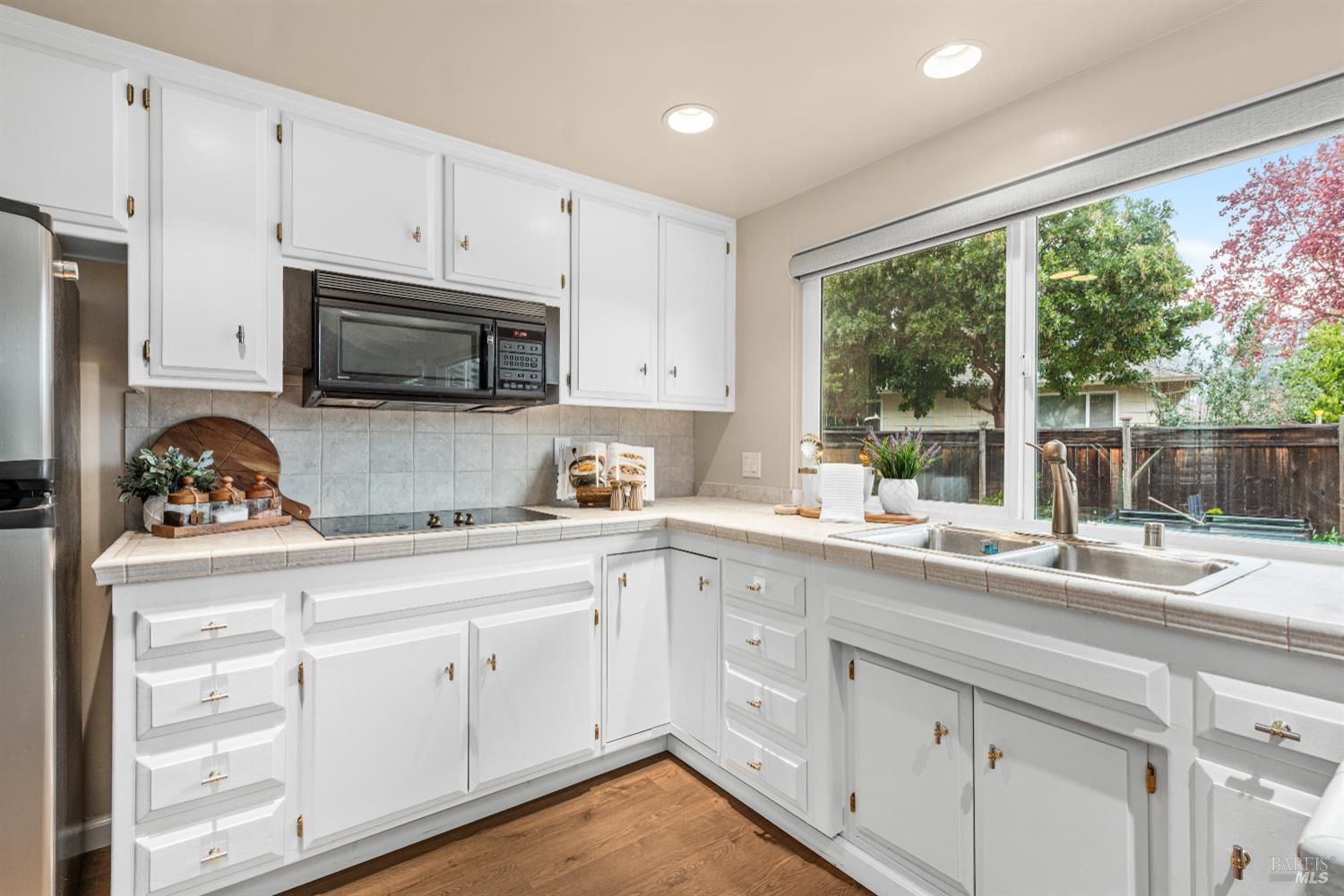 8853 Oak Trail Court Santa Rosa, CA 95409 - Photo 14 of 39 Lots of storage in this functional kitchen overlooking the backyard