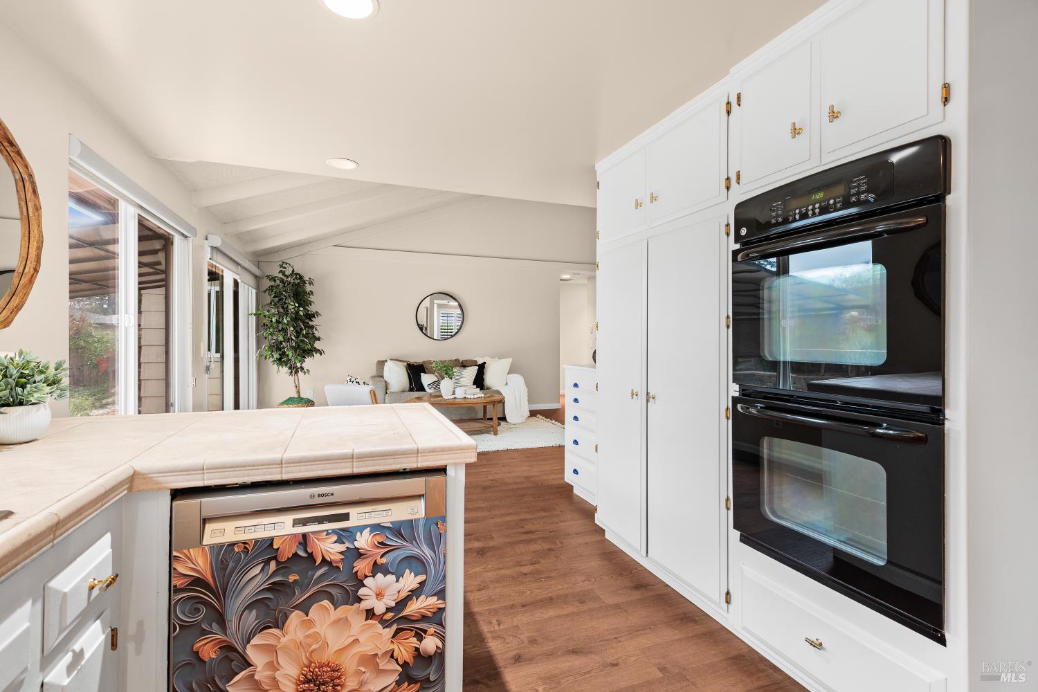 8853 Oak Trail Court Santa Rosa, CA 95409 - Photo 16 of 39 The kitchen centers on an island that serves as a workstation for meal prep, casual dining, and entertaining