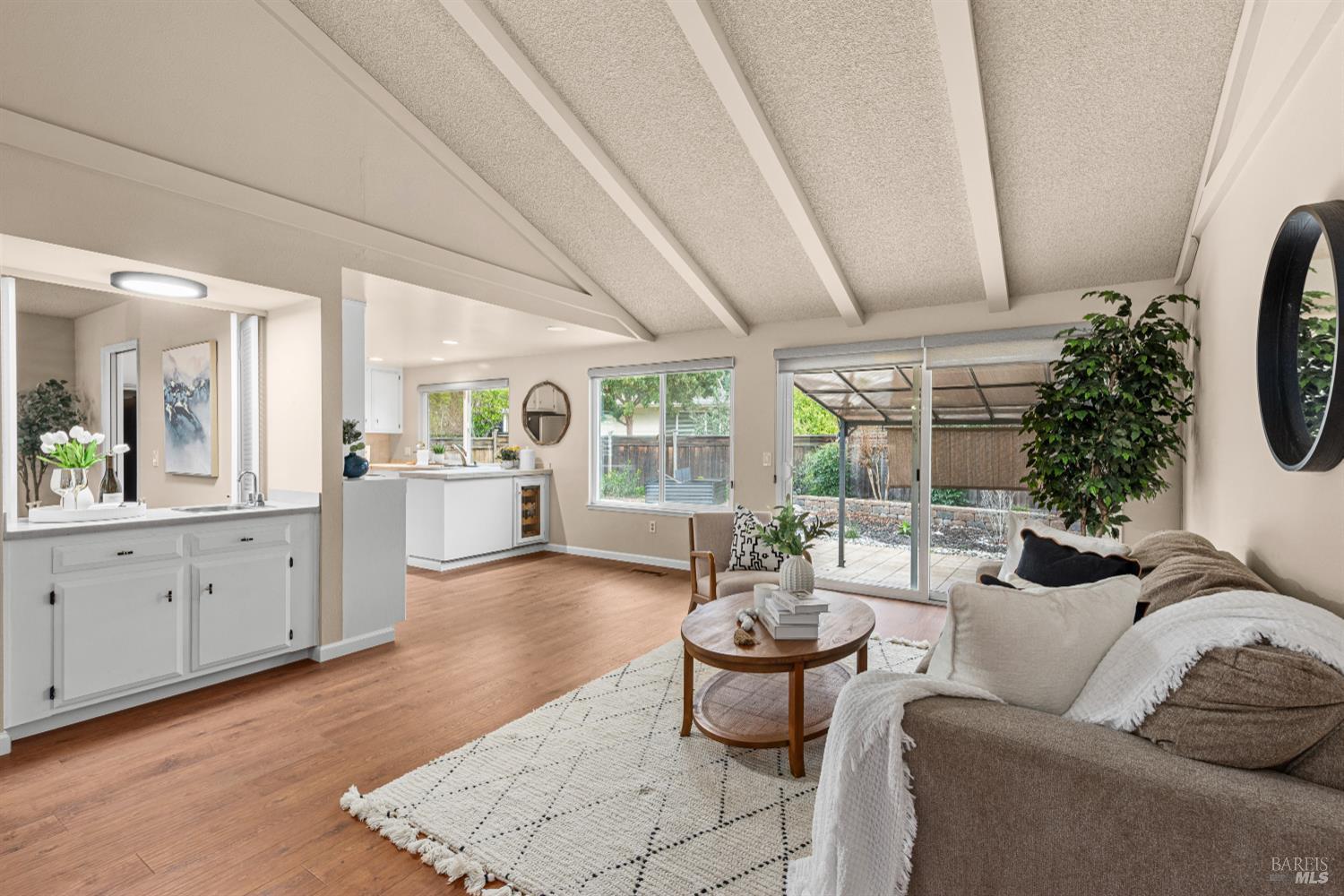 8853 Oak Trail Court Santa Rosa, CA 95409 - Photo 2 of 39 Your gaze is naturally pulled through the hallway into the spacious family room with vaulted ceilings.