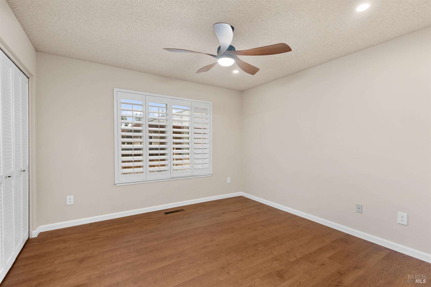 8853 Oak Trail Court Santa Rosa, CA 95409 - Photo 26 of 39 2nd bedroom has plantation shutters, a fan light, and recessed lighting