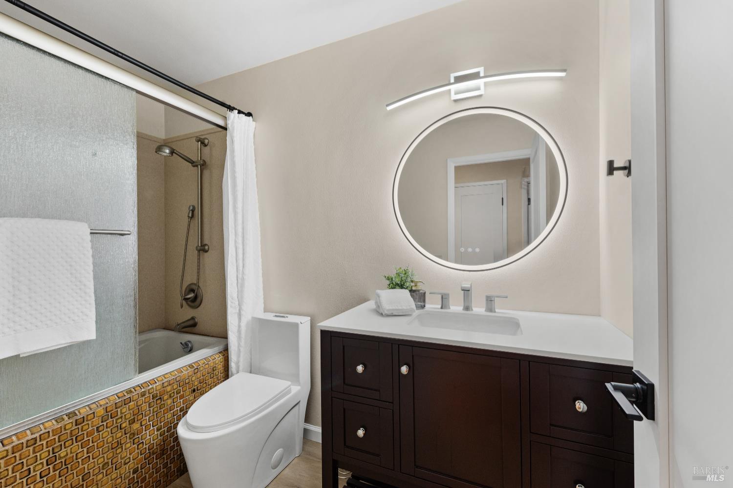 8853 Oak Trail Court Santa Rosa, CA 95409 - Photo 27 of 39 The hall bath has a spa-like soaking tub with a shower and modern features, like a mirror with various light settings
