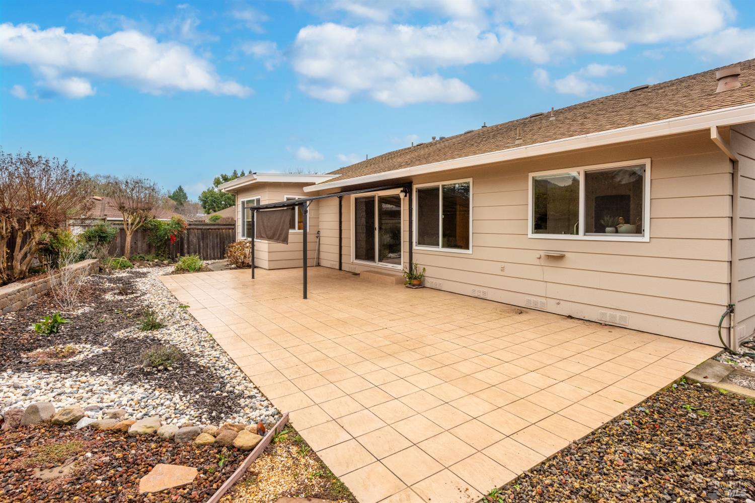8853 Oak Trail Court Santa Rosa, CA 95409 - Photo 33 of 39 Enjoy a seamless transition from cozy family gatherings to sunlit relaxation on your tiled patio
