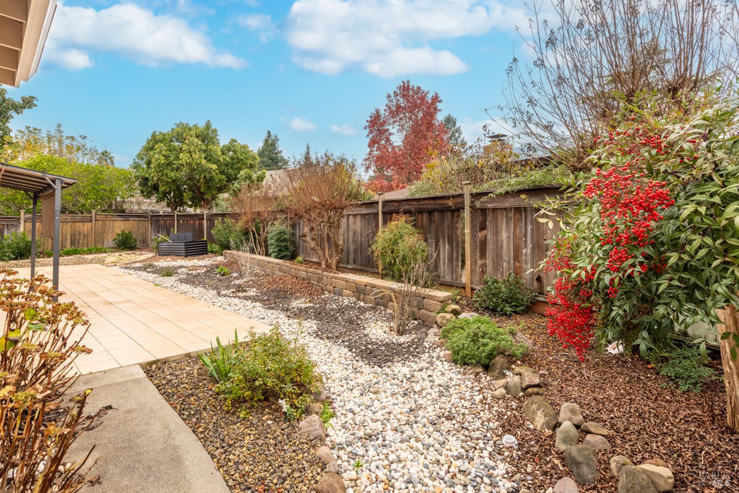8853 Oak Trail Court Santa Rosa, CA 95409 - Photo 36 of 39 The tile patio is the anchor of an outdoor sanctuary