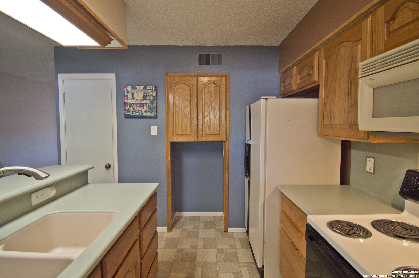 6427 Wurzbach Road, Unit 4 San Antonio, TX 78240 - Photo 11 of 30 a bathroom with a tub sink and a refrigerator