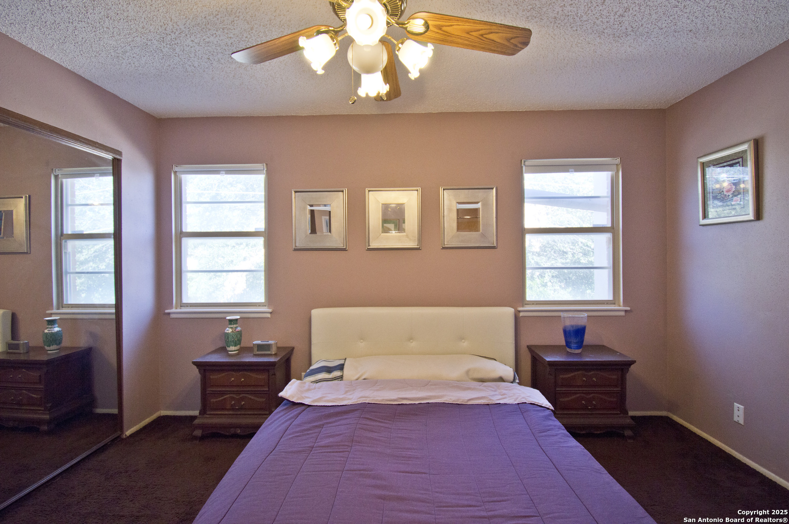 6427 Wurzbach Road, Unit 4 San Antonio, TX 78240 - Photo 15 of 30 a bedroom with a bed and wooden floor