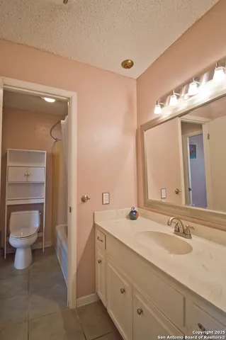 a bathroom with a toilet and shower