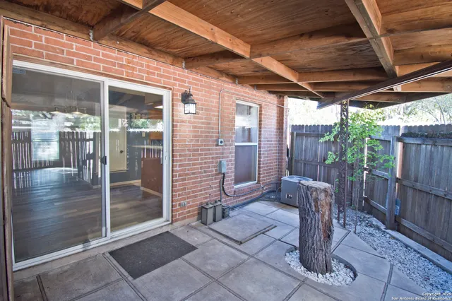 a view of backyard with a patio