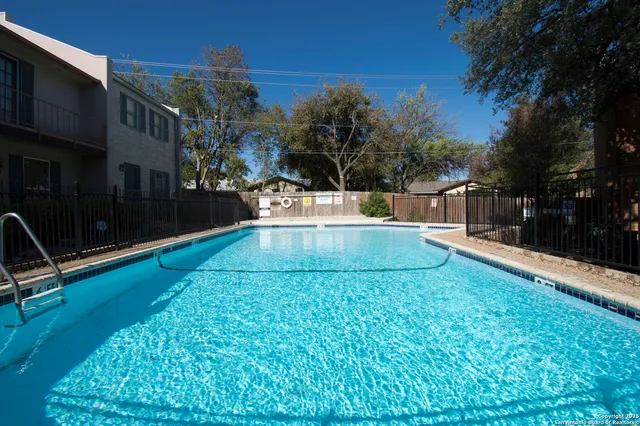 a view of outdoor space with wooden fence