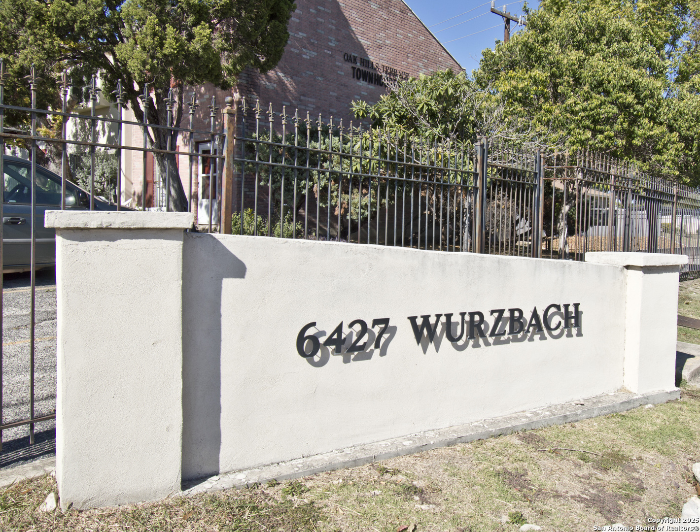 6427 Wurzbach Road, Unit 4 San Antonio, TX 78240 - Photo 30 of 30 a view of a sign board with large tree