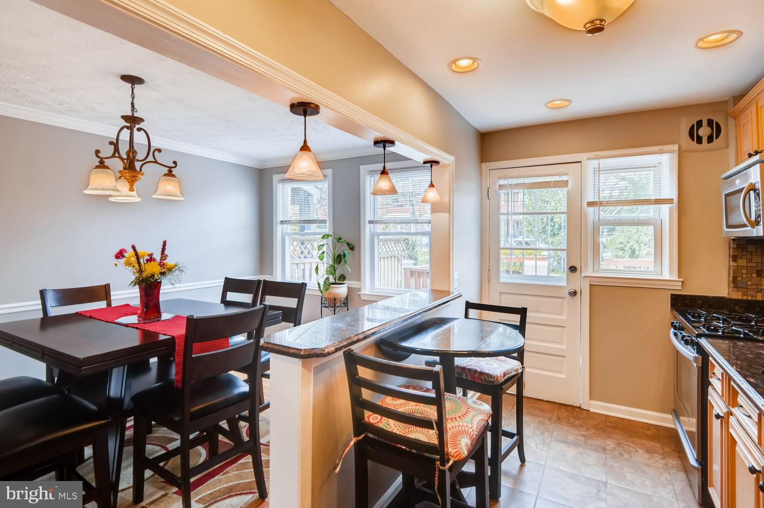 8322 Byington Road Towson, MD 21286 - Photo 11 of 31 Eat-in kitchen / breakfast bar with pendant lights