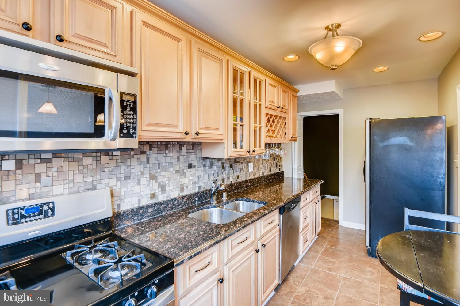 8322 Byington Road Towson, MD 21286 - Photo 12 of 31 Stainless steel appliances / tile backsplash