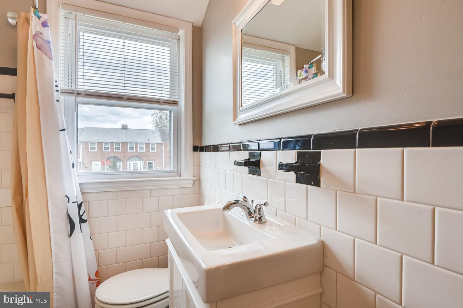8322 Byington Road Towson, MD 21286 - Photo 15 of 31 Black & white tile with modern updates in bathroom