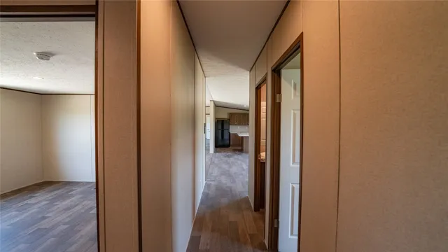 a view of a bathroom from a hallway