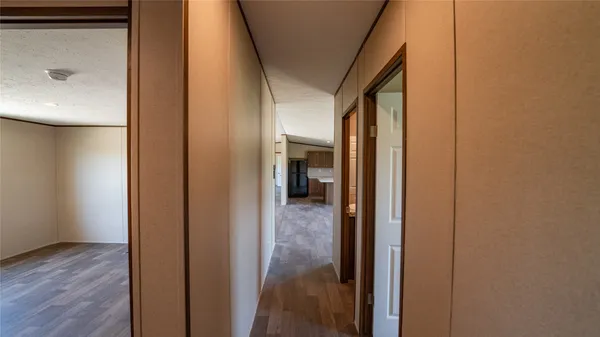 a view of a bathroom from a hallway