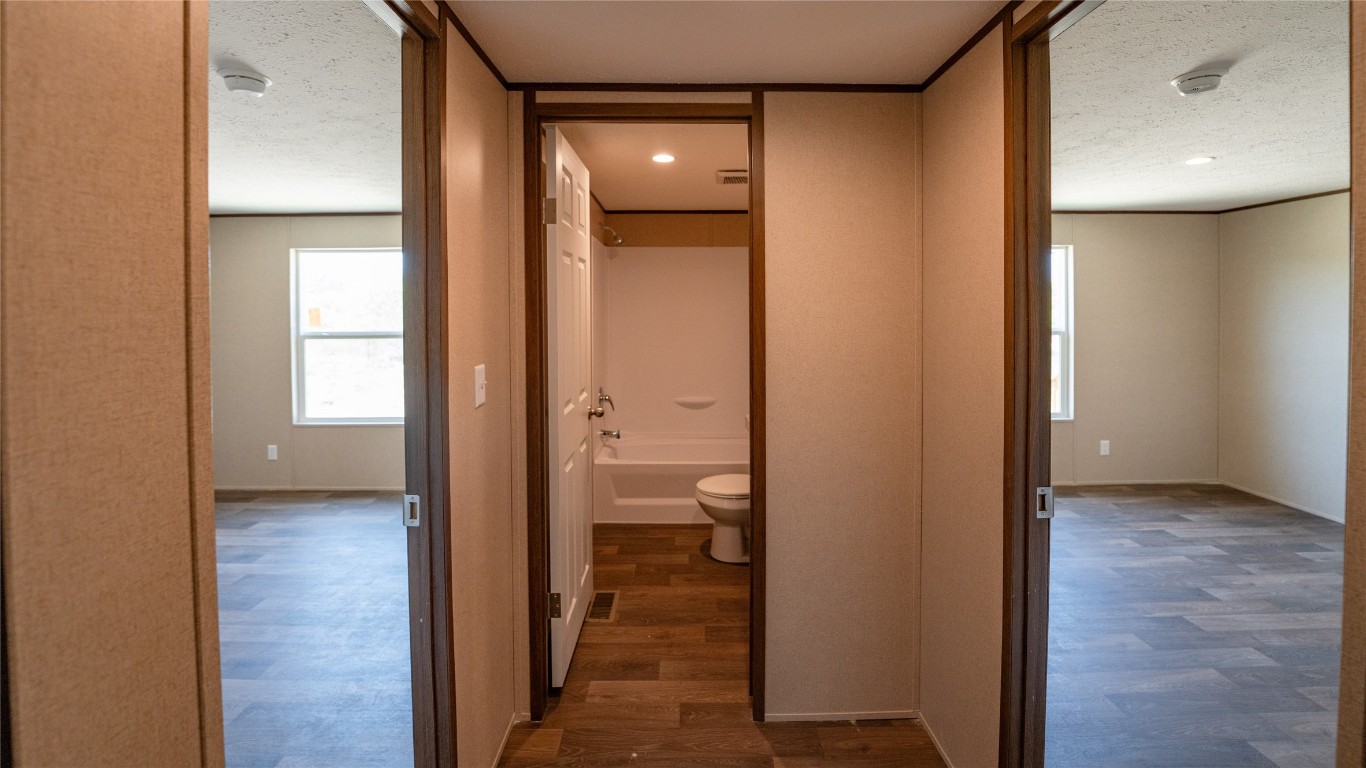 1121 Callihan Road Luling, TX 78648 - Photo 20 of 35 a view of a bathroom from a hallway