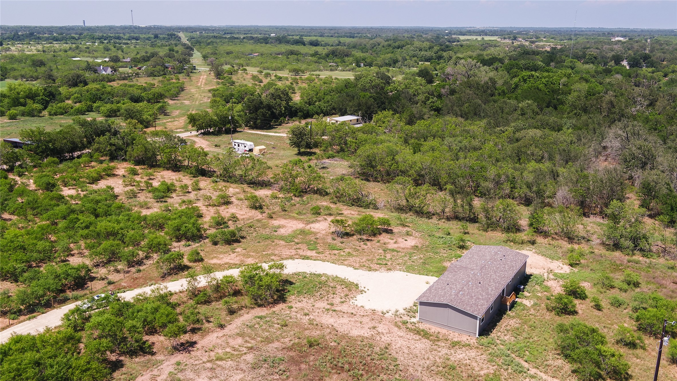 1121 Callihan Road Luling, TX 78648 - Photo 30 of 35 Aerial view of a heavily wooded area