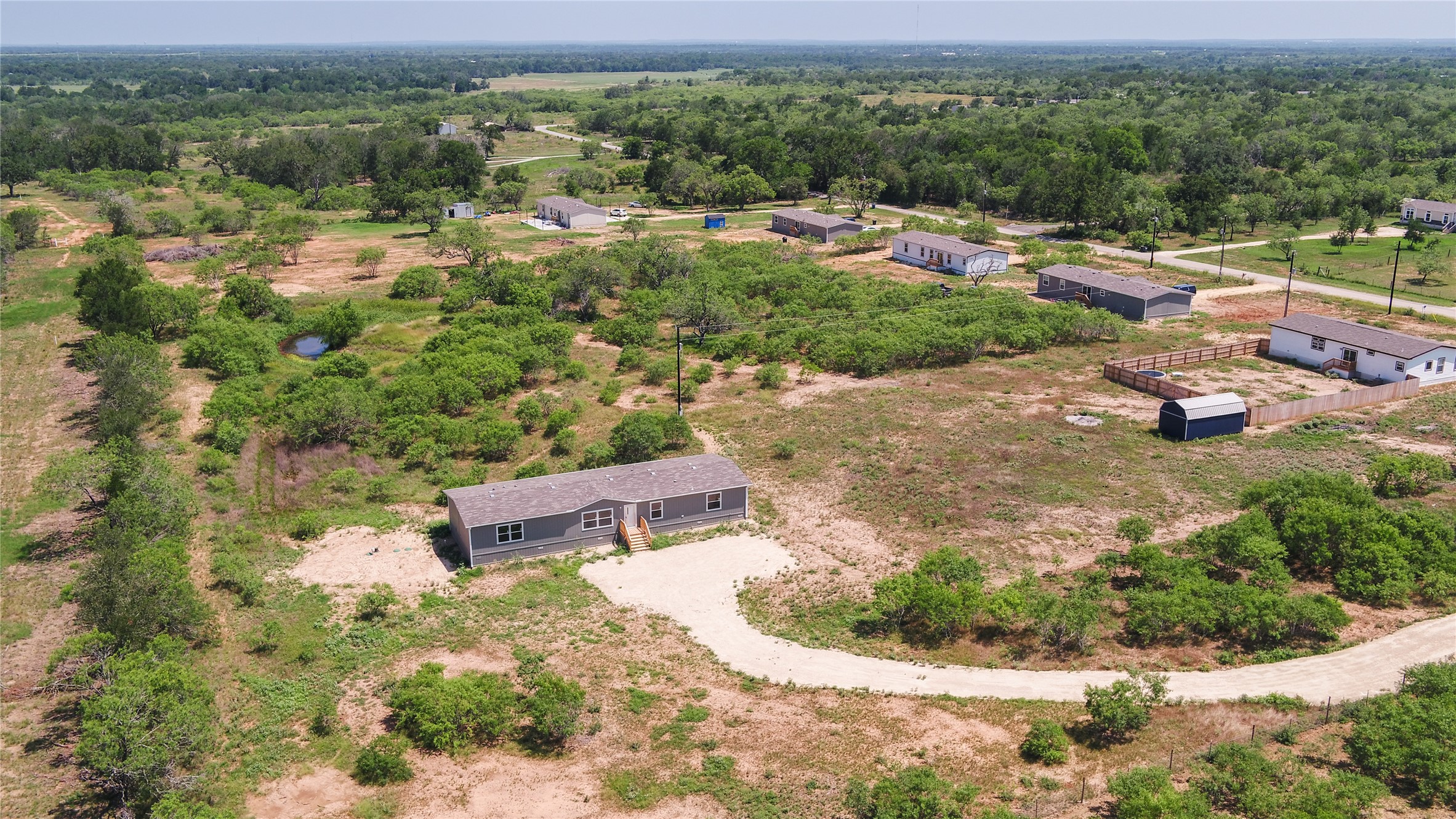 1121 Callihan Road Luling, TX 78648 - Photo 33 of 35 Drone / aerial view of a forest