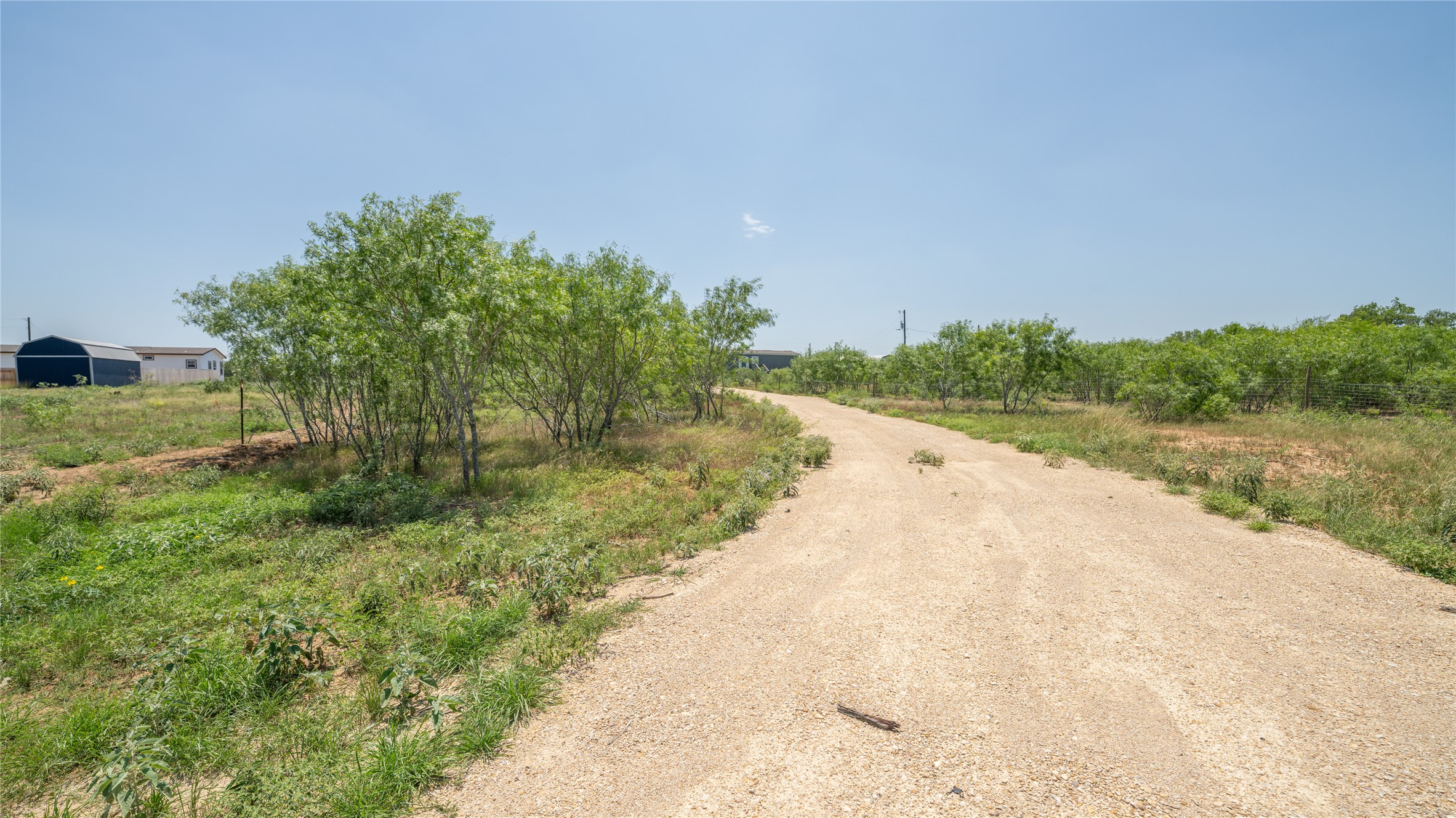 1121 Callihan Road Luling, TX 78648 - Photo 6 of 35 View of dirt / gravel road with a rural view