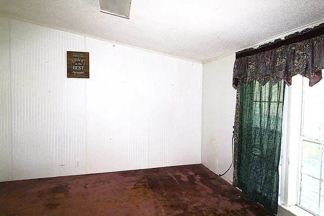 a view of a kitchen with a refrigerator