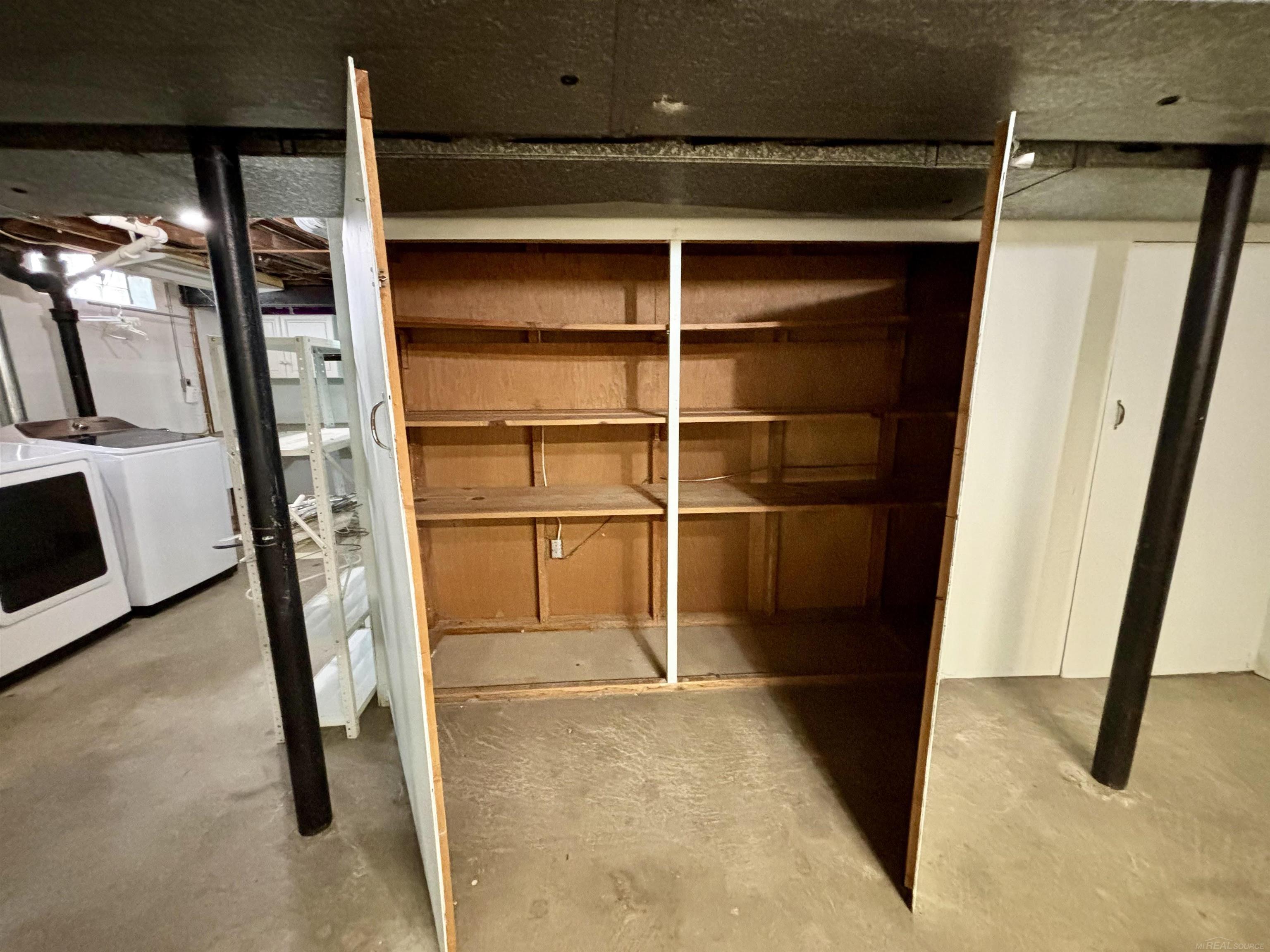18043 Winsome Road Fraser, MI 48026 - Photo 26 of 32 Basement storage cabinets