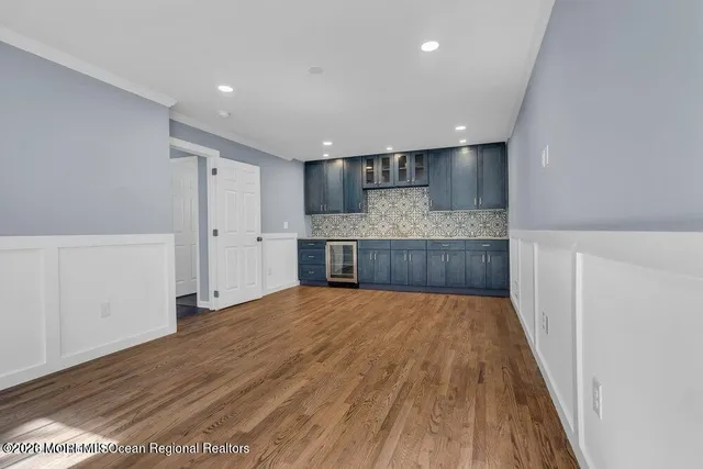 a view of kitchen and wooden floor