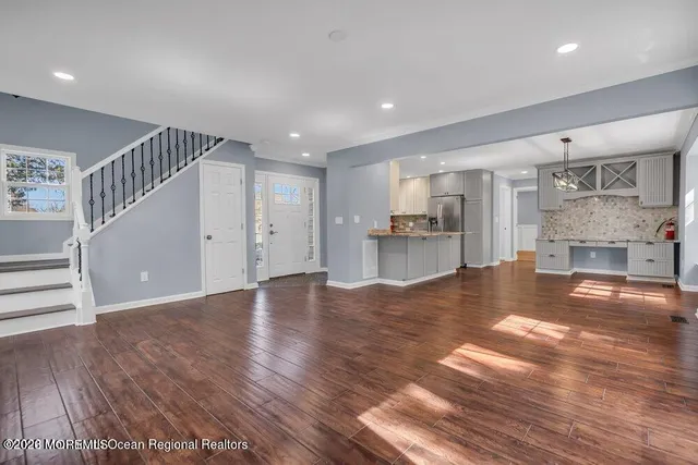 a view of a kitchen with a sink and a fireplace
