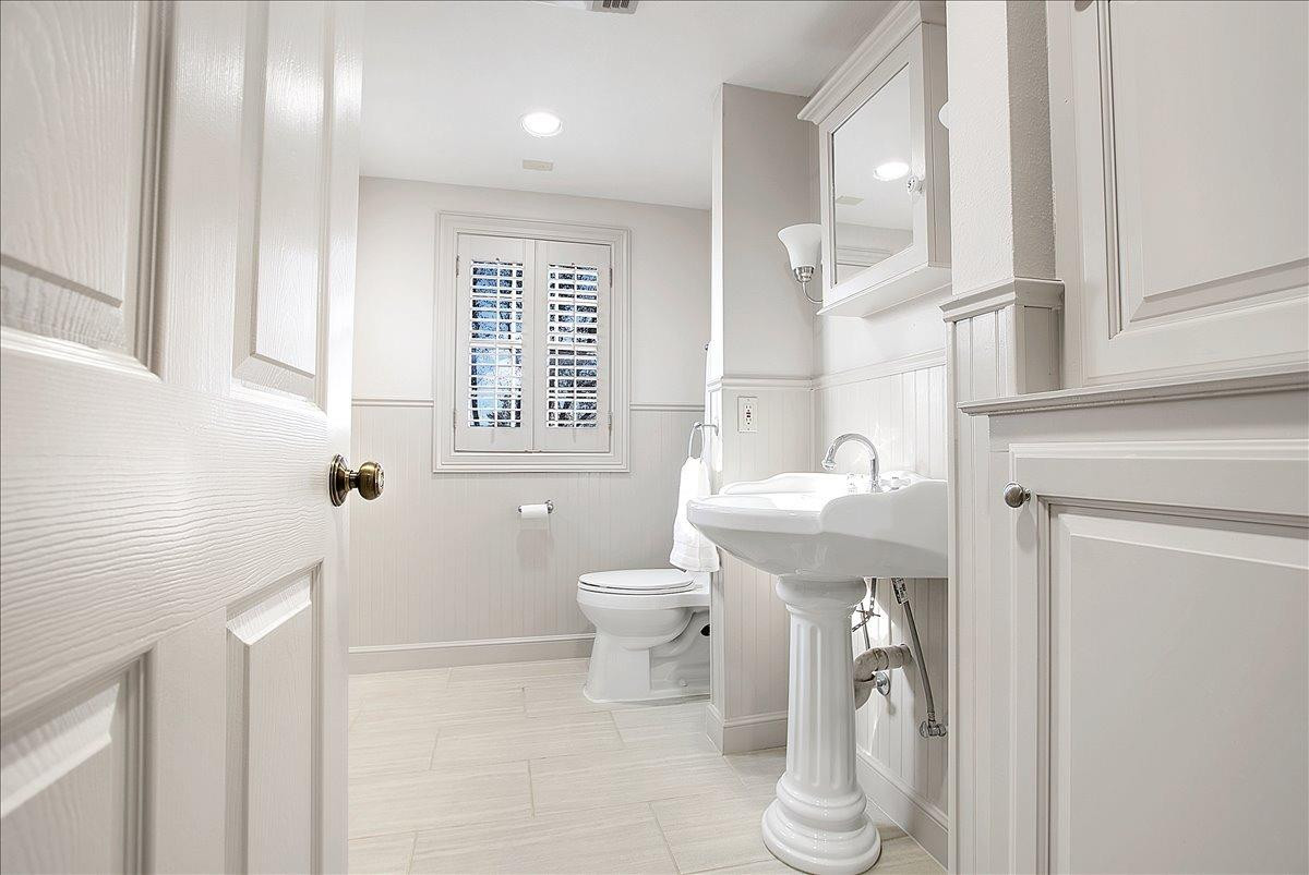 3203 32nd Street Lubbock, TX 79410 - Photo 19 of 27 a bathroom with a sink toilet and shower