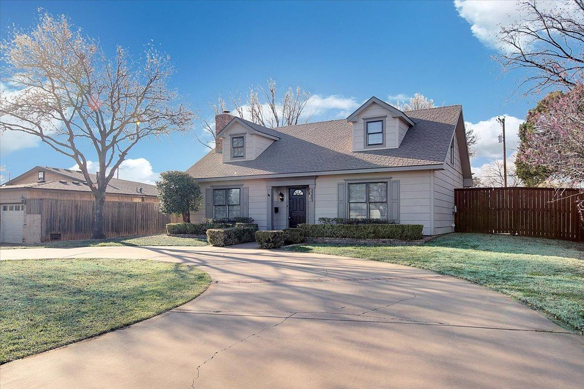 3203 32nd Street Lubbock, TX 79410 - Photo 2 of 27 a front view of a house with a yard