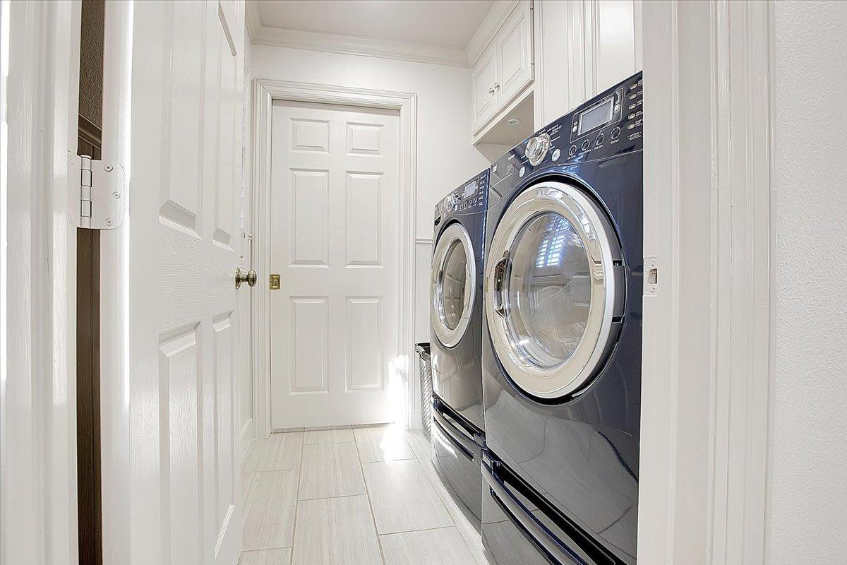 3203 32nd Street Lubbock, TX 79410 - Photo 22 of 27 a utility room with dryer and washer