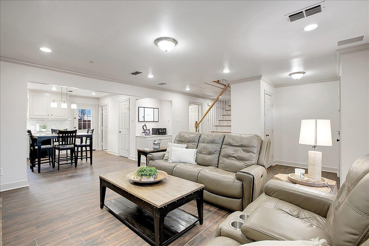 3203 32nd Street Lubbock, TX 79410 - Photo 5 of 27 a living room with furniture and wooden floor