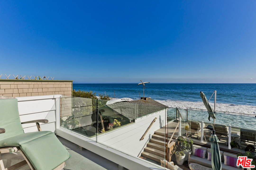 23626 Malibu Colony Road, Unit 53 Malibu, CA 90265 - Photo 16 of 24 a view of a roof deck with furniture