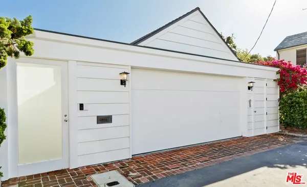 a view of a wooden door and a window
