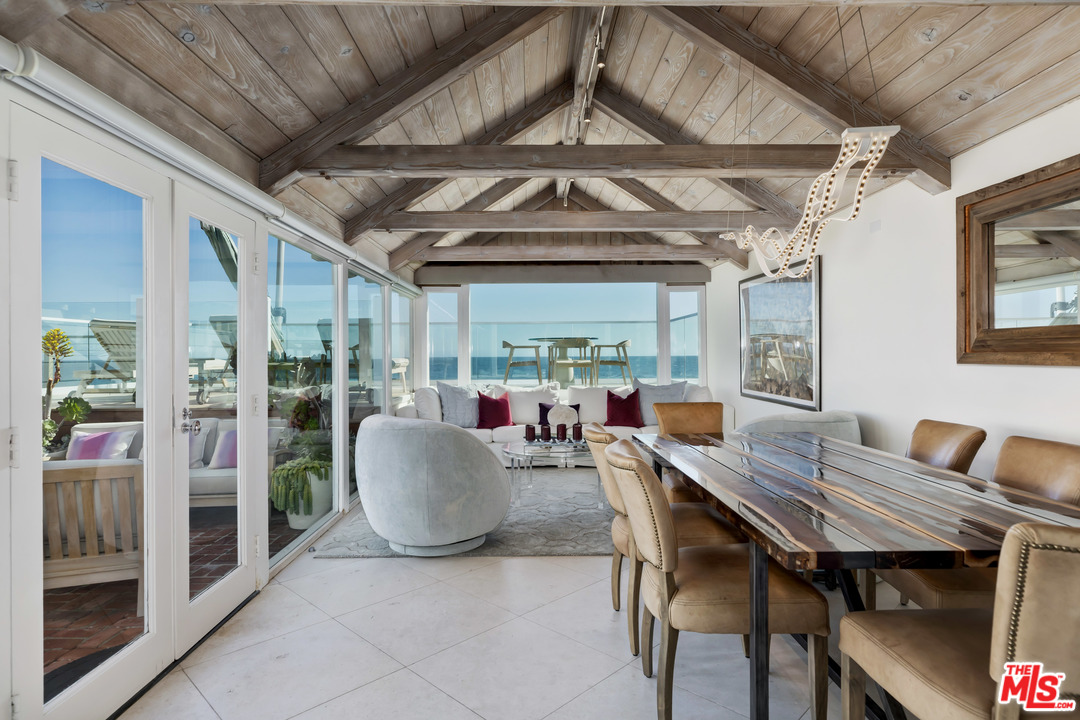23626 Malibu Colony Road, Unit 53 Malibu, CA 90265 - Photo 7 of 24 a view of a dining room with furniture window and outside view