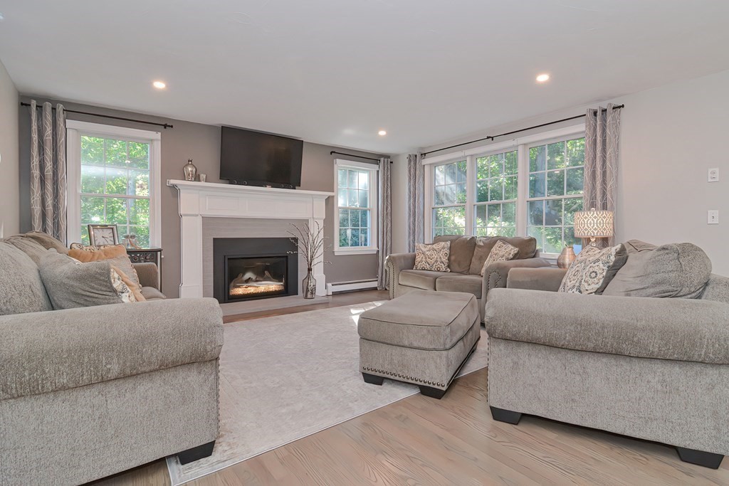 5 Tower Hill Drive Sandwich, MA 02563 - Photo 11 of 41 a living room with furniture and a fireplace