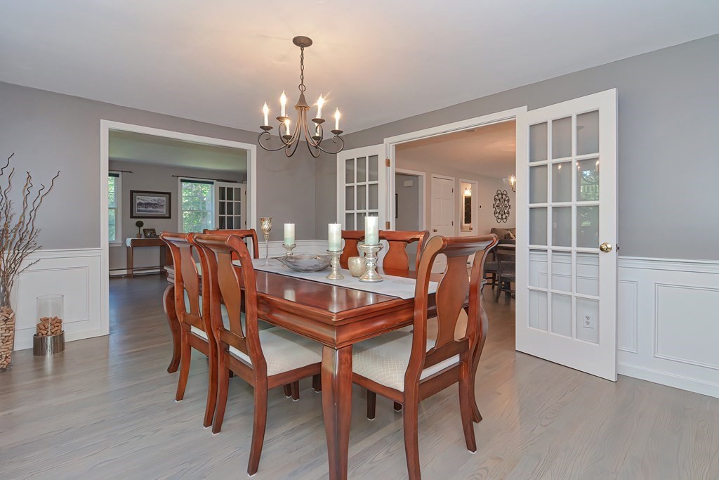 5 Tower Hill Drive Sandwich, MA 02563 - Photo 15 of 41 a view of a dining room with furniture and chandelier