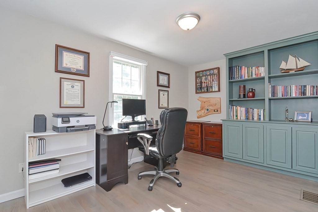 5 Tower Hill Drive Sandwich, MA 02563 - Photo 16 of 41 a view of a workspace with furniture and a bookshelf