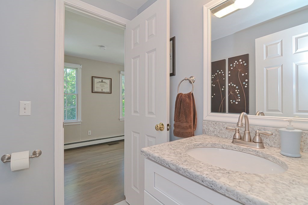 5 Tower Hill Drive Sandwich, MA 02563 - Photo 18 of 41 a bathroom with a granite countertop sink and a mirror