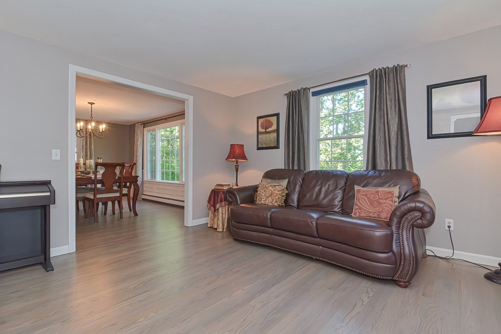 5 Tower Hill Drive Sandwich, MA 02563 - Photo 19 of 41 a living room with furniture and a wooden floor