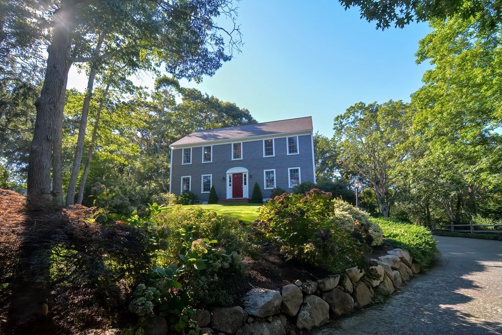 5 Tower Hill Drive Sandwich, MA 02563 - Photo 2 of 41 a view of a house with a yard and potted plants