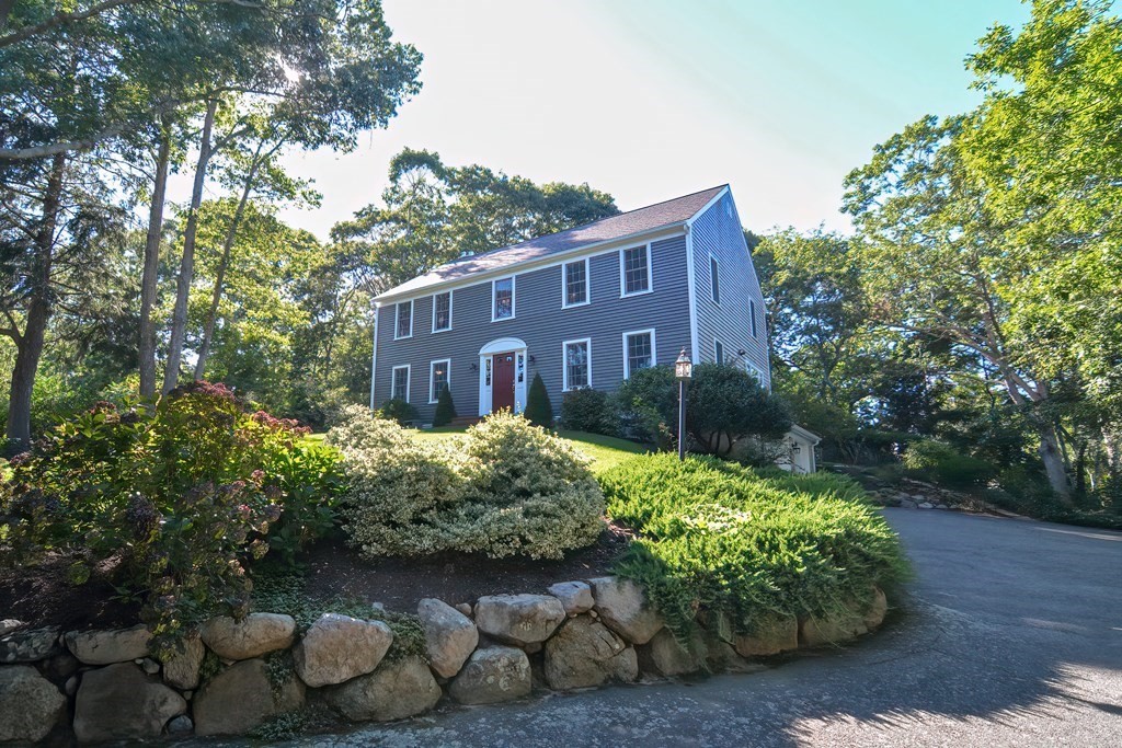 5 Tower Hill Drive Sandwich, MA 02563 - Photo 3 of 41 a front view of a house with garden
