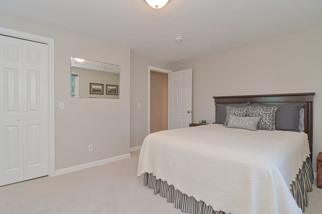 5 Tower Hill Drive Sandwich, MA 02563 - Photo 31 of 41 a bedroom with a bed and a painting on the wall