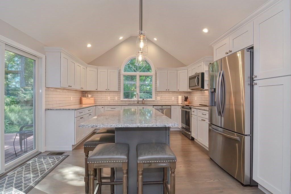 5 Tower Hill Drive Sandwich, MA 02563 - Photo 4 of 41 a kitchen with granite countertop a center island stainless steel appliances cabinets and a large window